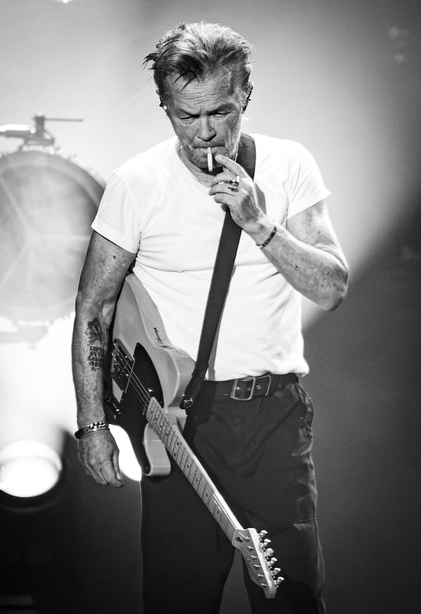 John Mellencamp loves his cigarettes, which apparently have not degraded his vocal abilities. He performed to a sold-out show Saturday night, Aug. 1, 2026 at Ameris Bank Amphitheatre. (RYAN FLEISHER FOR THE ATLANTA JOURNAL-CONSTITUTION)
