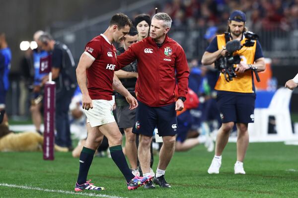 Tomos Williams of the British & Irish Lions is assisted from the field during their rugby match against the Western Force in Perth, Australia, Saturday, June 28, 2025. (AP Photo/Trevor Collens)