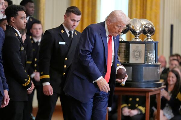 President Donald Trump departs after the Commander-in-Chief trophy presentation to the Navy Midshipman football team in the East Room of the White House, Tuesday, April 15, 2025, in Washington. (AP Photo/Manuel Balce Ceneta)