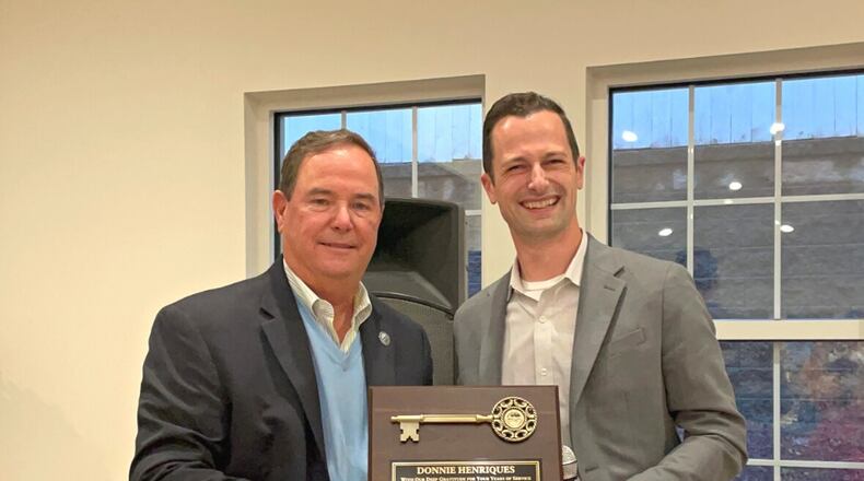 (L-R) Woodstock Mayor Donnie Henriques was presented this month a key to the city by Mayor-Elect Michael Caldwell to thank Henriques upon his retirement on Dec. 31 after 16 years of service as the city's mayor. (Courtesy of Woodstock)