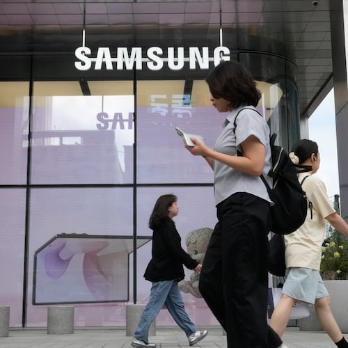 People pass by Samsung Gangnam store in Seoul, South Korea, Thursday, July 30, 2026. (AP Photo/Ahn Young-joon)