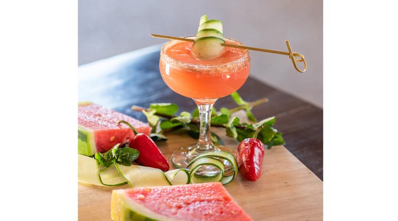 Watermelon chunks, cucumbers and mezcal, among other ingredients, go into "Love Your Neighbor," a drink offered by From the Earth Brewing Co. in the Summer Sippin' Roswell beverage competition.