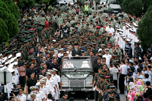 FILE - Malaysian outgoing Prime Minister Abdullah Ahmad Badawi, also Defence Minister, center, looks on during a farewell ceremony organised by the Defence Ministry in Kuala Lumpur, Malaysia, Thursday, April 2, 2009. (AP Photo/Lai Seng Sin, File)