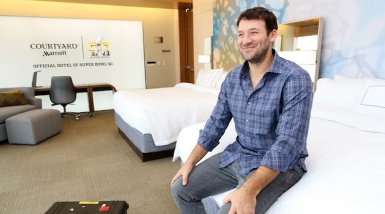 IMAGE DISTRIBUTED FOR COURTYARD - Dallas Cowboys quarterback Tony Romo lounges at a Levi's Stadium suite turned Courtyard hotel room, where the winner of Courtyard's "Suite Stadium" contest will sleep on the eve of SUPER BOWL 50, on Wednesday, Feb. 3, 2016 in Santa Clara, Calif. (Tomas Ovalle/AP Images for Courtyard)