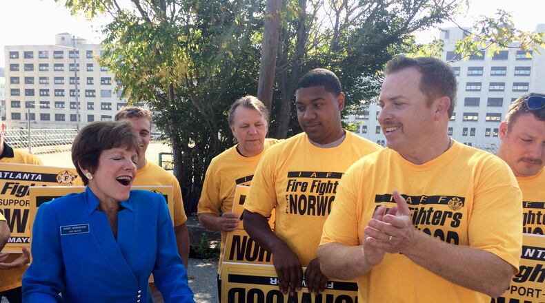 Atlanta City Councilwoman Mary Norwood, left, and International Association of Fire Fighters Local 134 President Paul Gerdis speak during a campaign event Tuesday, Sept. 19, 2017. The IAFF endorsed Norwood in her run for mayor. STRUBEY/AJC