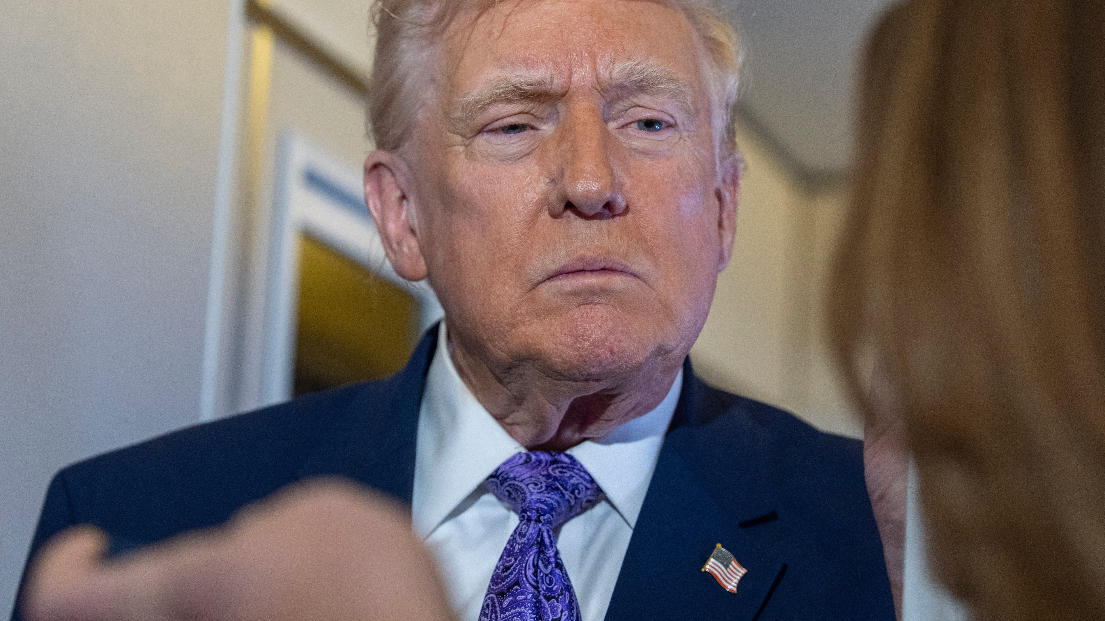 President Donald Trump speaks with reporters while in flight on Air Force One from his Mar-a-Lago estate in Palm Beach, Fla., to Joint Base Andrews, Sunday, Nov. 30, 2025. (AP Photo/Alex Brandon)