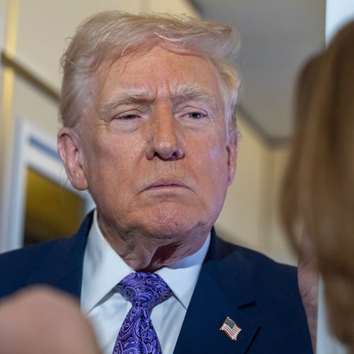 President Donald Trump speaks with reporters while in flight on Air Force One from his Mar-a-Lago estate in Palm Beach, Fla., to Joint Base Andrews, Sunday, Nov. 30, 2025. (AP Photo/Alex Brandon)