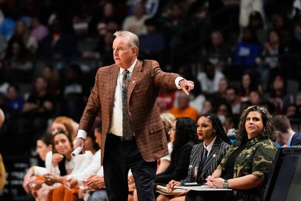 Texas head coach Vic Schaefer calls out from the bench during the first half against Tennessee in the Sweet 16 of the NCAA college basketball tournament, Saturday, March 29, 2025. in Birmingham, Ala. (AP Photo/Gerald Herbert)