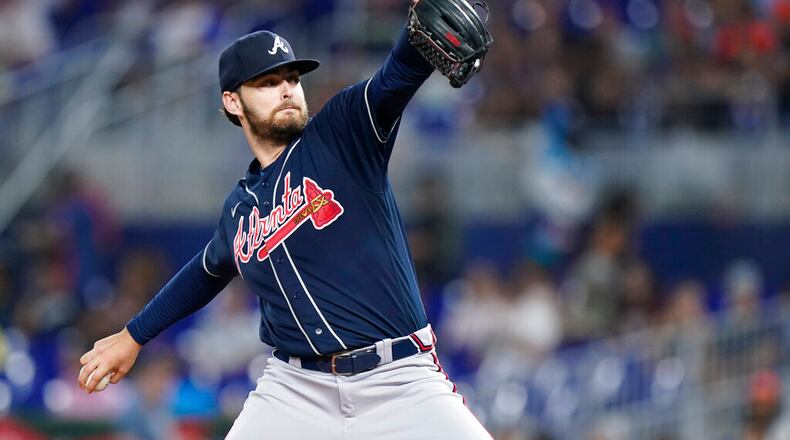 Atlanta Braves' Ian Anderson delivers a pitch during the first inning of the second game of a baseball doubleheader against the Miami Marlins, Saturday, Aug. 13, 2022, in Miami. (AP Photo/Wilfredo Lee)