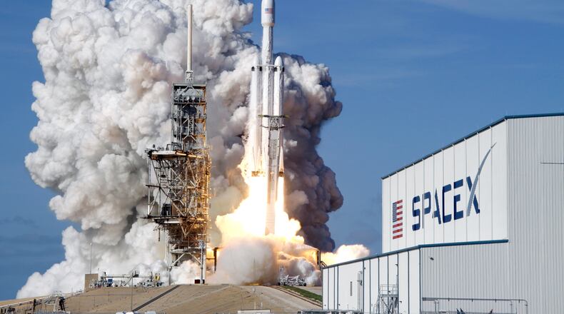 FILE - A Falcon 9 SpaceX heavy rocket lifts off from pad 39A at the Kennedy Space Center in Cape Canaveral, Fla., Tuesday, Feb. 6, 2018. (AP Photo/John Raoux, File)
