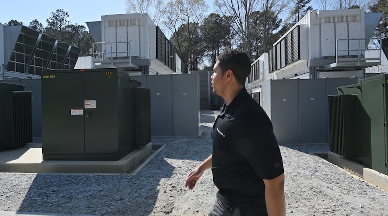Jason Sanders, general manager, walks through the Cleanspark Bitcoin Mining Facility in College Park. Georgia is attracting more cryptocurrency companies like CleanSpark. (Hyosub Shin / Hyosub.Shin@ajc.com)