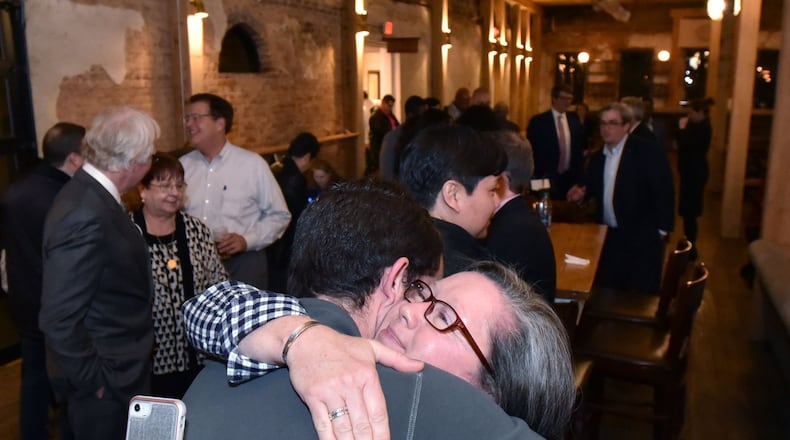 Paige Havens of Go Gwinnett gets a hug from Mason Havens after they found out Gwinnett County’s MARTA referendum failed during an election night watch party at Slow Pour Brewing Company in Lawrenceville on Tuesday, March 19, 2019. HYOSUB SHIN / HSHIN@AJC.COM
