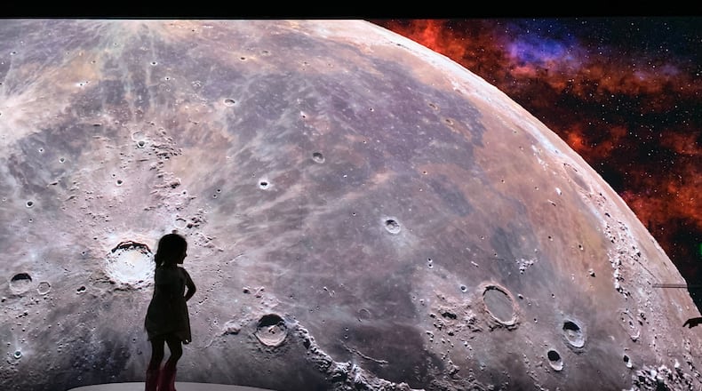 The latest Illuminarium immersive experience is focused on "Space" including the moon landing, trips to the outer edges of the solar system and the constellations. RODNEY HO/rho@ajc.com