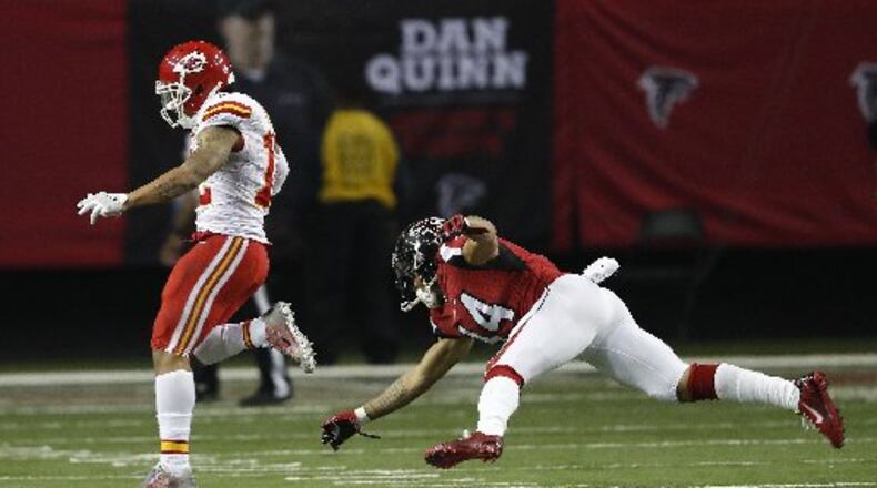Albert Wilson gets away from Eric Weems during his 55-yard touchdown run on a fake punt. (AP Photo)