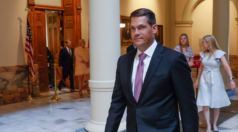 Lt. Gov. Geoff Duncan leads the entourage to the bill signing, as Gov. Brian Kemp enters from the door at left. With much fanfare, Gov. Brian Kemp signsed HB 1013, which aims to increase access to mental health coverage in Georgia on Sine Die, the last day of the General Assembly at the Georgia State Capitol in Atlanta on Monday, April 4, 2022. (Bob Andres / robert.andres@ajc.com)
