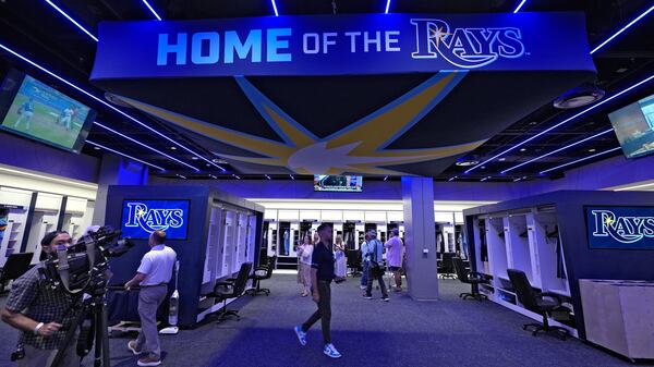Members of the media look around the Tampa Bay Rays clubhouse at George M. Steinbrenner Field during a stadium tour Wednesday, March 26, 2025, in Tampa, Fla. (AP Photo/Chris O'Meara)