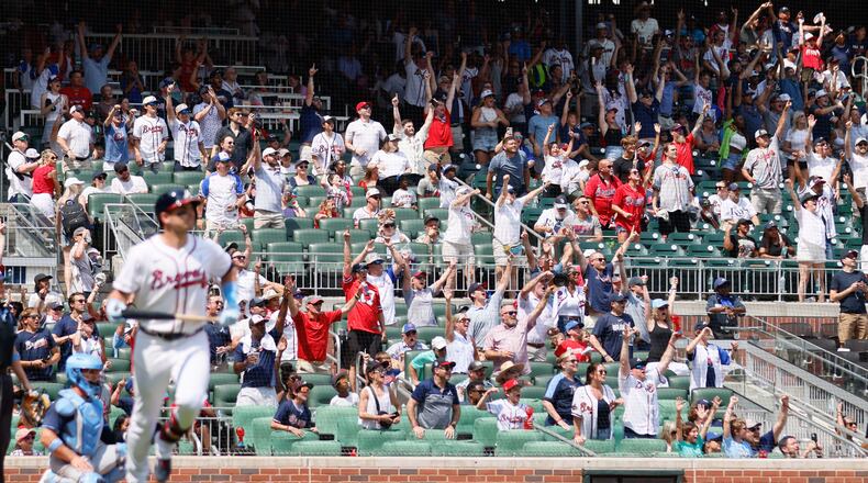 Atlanta Braves fans jump off their seat as they watch Braves third baseman Austin Riley (27) hitting a two-run home run at the bottom of the eighth inning against the Tampa Bay Rays at Truist Park on Sunday, June 16, 2024, in Atlanta.
(Miguel Martinez/ AJC)