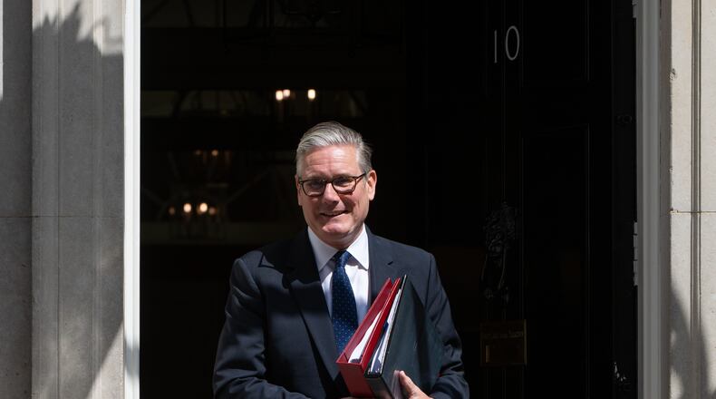 Britain's Prime Minister Keir Starmer leaves 10 Downing Street to attend Prime Minister's Questions at the House of Commons in London, Wednesday, July 15, 2026. (AP Photo/Thomas Krych)