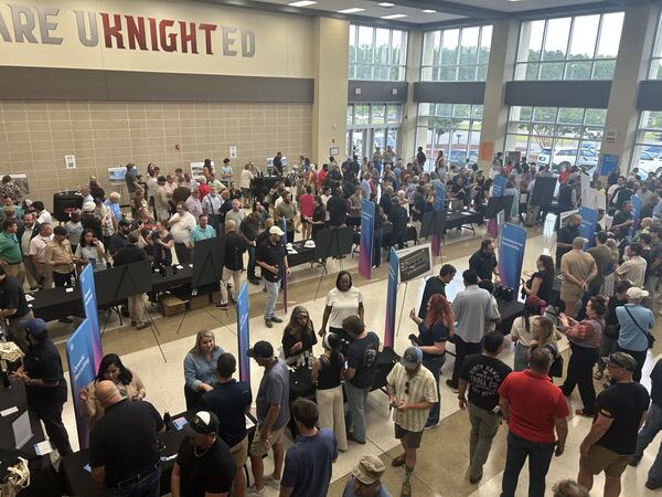 Savannah-area residents packed the Effingham College and Career Academy atrium for an OpenAI data center open house. Spoiler: They weren't fans. (Adam Van Brimmer/AJC)