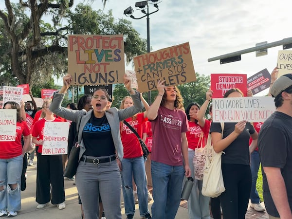Students and activists rally for gun control policies outside of Florida's historic old capitol on Wednesday, April 23, 2025 in Tallahassee, Fla., less than a week after a deadly shooting at Florida State University. (AP Photo/Kate Payne)