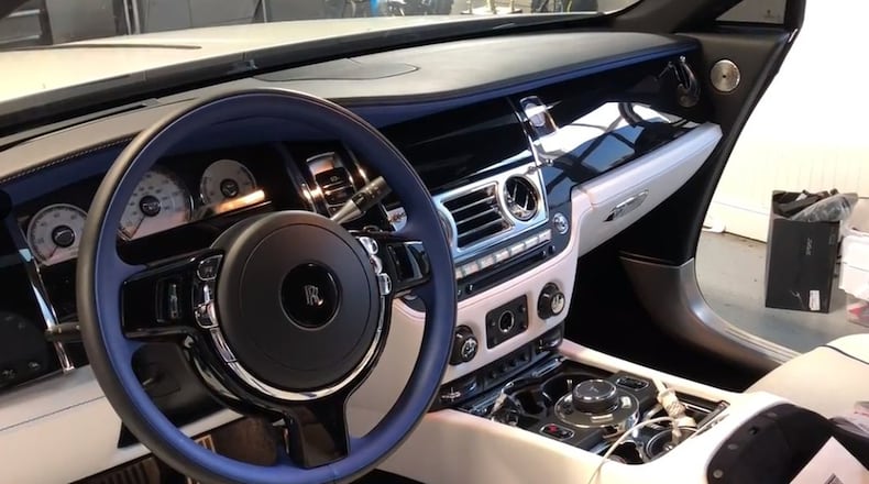 Georgia Department of Revenue agents found a Rolls-Royce Wraith with Montana plates Oct. 19 at the Cobb County home of Dustin Farthing, an exotic car collector. They served a search warrant as part of what they believe is a first-of-its kind investigation into a tax doge where owners register their cars in Montana. Farthing was not charged. WILLOUGHBY MARIANO / WMARIANO@AJC.COM