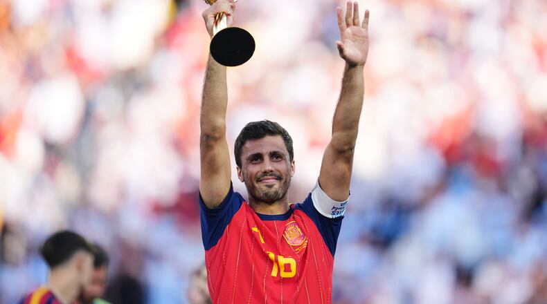 Spain's Rodri celebrates with the tournament's best player award after the World Cup final soccer match between Spain and Argentina in East Rutherford, N.J., near New York, Sunday, July 19, 2026. (AP Photo/Abbie Parr)