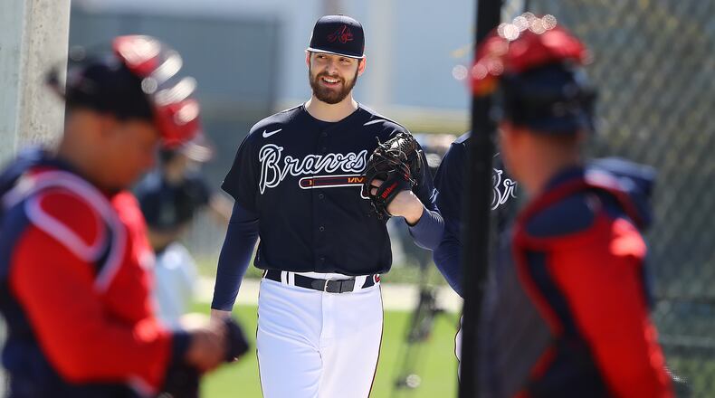 Braves pitcher Ian Anderson was all smiles walking to the pitching mounds to get in some work on March 13 at CoolToday Park. Anderson likes the team's chances to repeat if the players stay dedicated. (Curtis Compton / curtis.compton@ajc.com)
