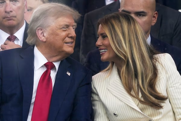 President Donald Trump and first lady Melania Trump attend a military parade commemorating the Army's 250th anniversary, coinciding with his 79th birthday, Saturday, June 14, 2025, in Washington. (AP Photo/Julia Demaree Nikhinson)