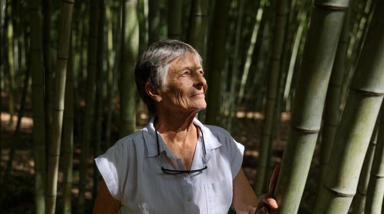 Daphne Lewis poses at her bamboo farm in Hawkinsville on Sept. 16, 2026. Bamboo, she says, is "a total ecological miracle." (Arvin Temkar/AJC)