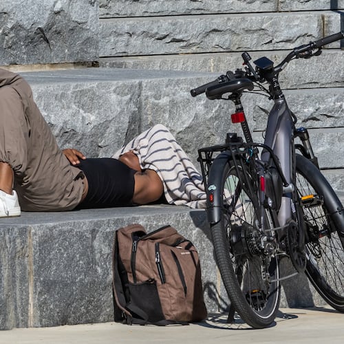Georgia Tech student Kelsey Chambers found a comfortable spot in between classes as temperatures soared toward 90 degrees last year. Atlanta is expected to reach 90 degrees today for the first time this year. (AJC File)