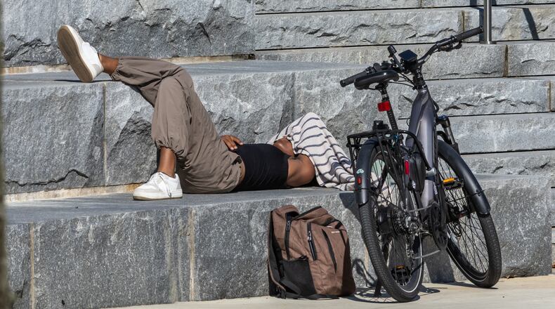 Georgia Tech student Kelsey Chambers found a comfortable spot in between classes as temperatures soared toward 90 degrees last year. Atlanta is expected to reach 90 degrees today for the first time this year. (AJC File)