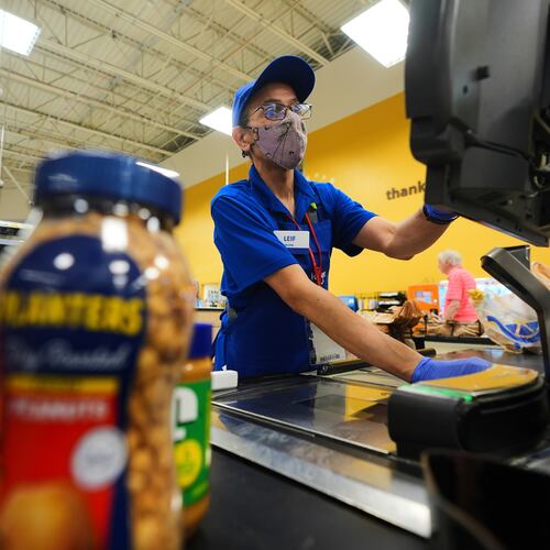 FILE -A cashier rings up groceries in Dallas, Aug. 28, 2025. (AP Photo/LM Otero, File)