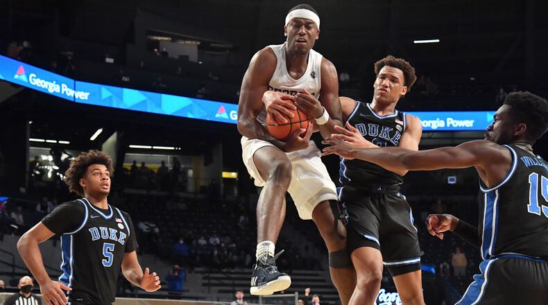 Georgia Tech's guard Michael Devoe (0) grabs a rebound over Duke forward Wendell Moore Jr. (0) in the second half Tuesday, March 2, 2021, at McCamish Pavilion in Atlanta. The Yellow Jackets won 81-77 in overtime. (Hyosub Shin / Hyosub.Shin@ajc.com)
