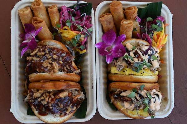 Kalua pork bao buns (left) and pineapple buns (right) prepared by Sara Siv and Jess Gorsuch, owners of Hapa Kitchen, at Block & Drum in Chamblee on Wednesday, June 17, 2026. (Hyosub Shin/AJC)