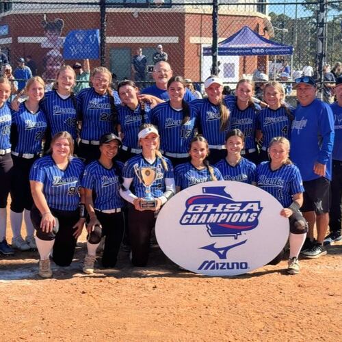 Bremen coaches and players celebrate with the trophy after winning the Class A Division I fast-pitch softball championship on Nov. 1, 2025, in Columbus. (Courtesy of Georgia High School Association)