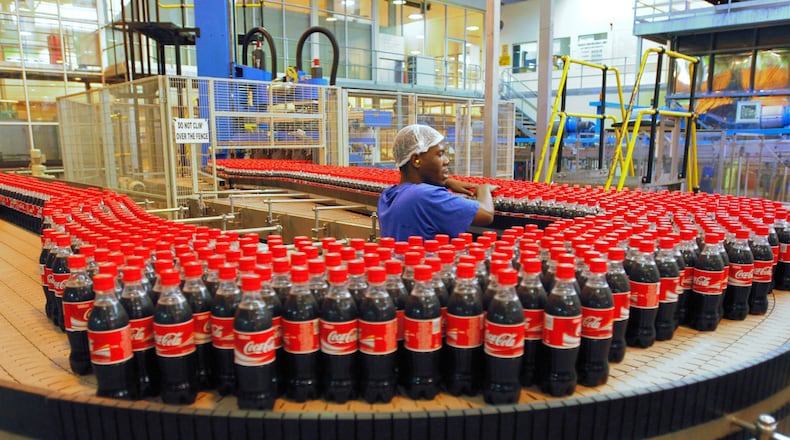 A Birmingham firm has taken over Coca-Cola’s bottling operations in metro Atlanta and other Georgia territories as part of Coke’s efforts to “refranchise” its global bottling operations. File photo of a South African bottling plant. Photographer: Henner Frankenfeld/Bloomberg News.