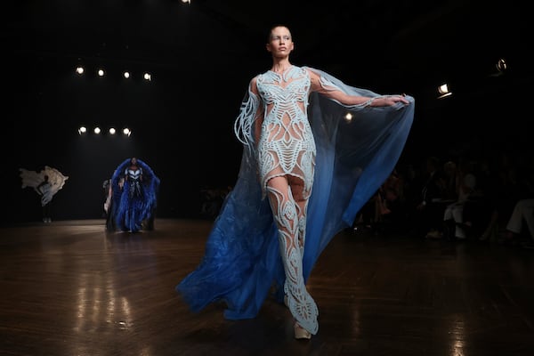 A model wears a creation as part of the Iris van Herpen Fall-Winter 2025/26 Haute Couture collection presented Monday, July 7, 2025, in Paris. (AP Photo/Tom Nicholson)