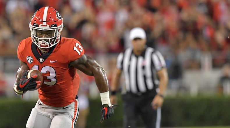 Former Georgia running back Elijah Holyfield has signed a professional wrestling contract with WWE NXT.