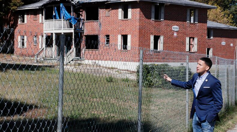 Atlanta City Councilman Antonio Brown, pictured here visiting blighted property in his district, sponsored the leglislation authorizing the loan program for small and micro businesses