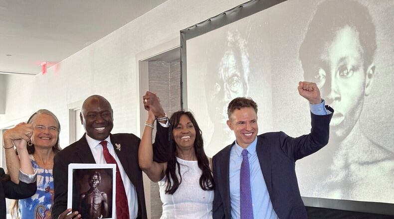 FILE - Susanna Moore, left, the great-great-great-granddaughter of Harvard biologist Louis Agassiz, celebrates with Tamara Lanier, second right, and attorneys Ben Crump and Josh Koskoff at the Boston Marriott Long Wharf hotel, May 28, 2025, in Boston, Mass. (AP Photo/Leah Willingham, File)