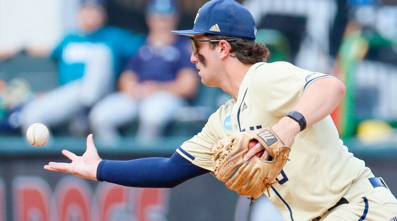 Georgia Tech third baseman Carson Kerce (6) maneuvers with the ball but manages to keep it for the second out during the ninth against UNC Wilmington at Foley Field in the NCAA Tournament Regional at Foley Field on Sunday, June 2, 2024, in Athens. Georgia Tech advanced in the NCAA Tournament Regional.
(Miguel Martinez / AJC)