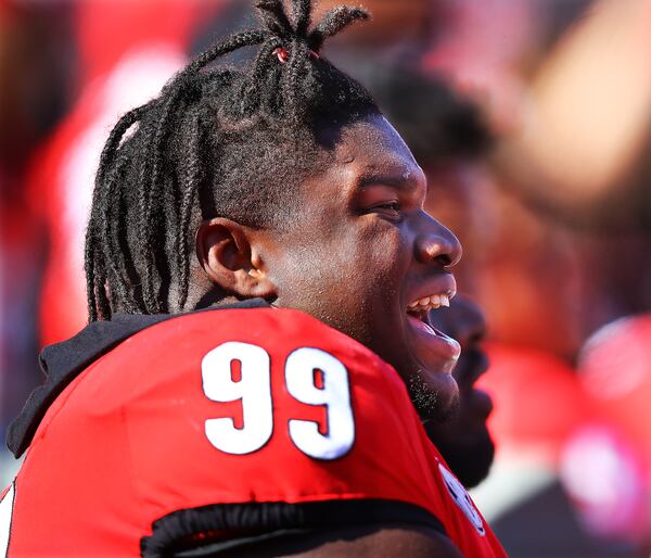 Georgia senior defensive lineman Jordan Davis is all smiles on the sidelines after getting to play a little offense on senior day.    “Curtis Compton / Curtis.Compton@ajc.com”
