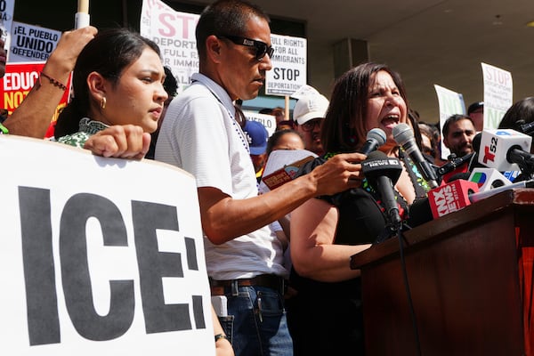 Angelica Salas, of The Coalition for Humane Immigrant Rights, speaks outside the Federal Building after federal immigration authorities conducted an operation on Friday, June 6, 2025, in Los Angeles. (AP Photo/Damian Dovarganes)
