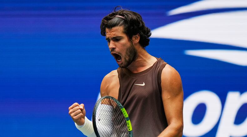Carlos Alcaraz, of Spain, reacts during a match against Roman Safiullin, of Russia, during the first round of the U.S. Open tennis championships, Monday, Aug. 31, 2026, in New York. (AP Photo/Seth Wenig)