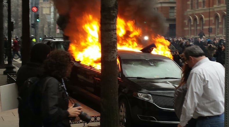 Protesters set this limo on fire. Photo: Jeff Ernsthausen