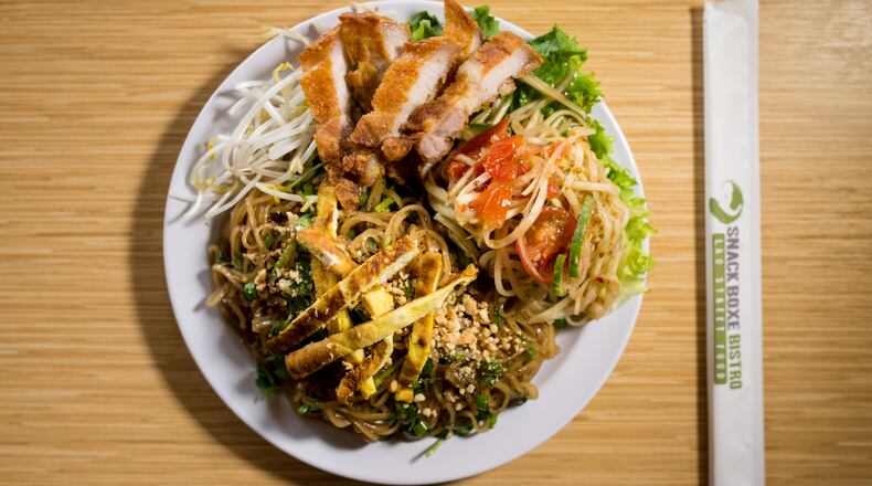 Snackboxe Bistro Weekly Special, Kua Mee, pan fried rice noodle with bean sprouts, egg omelette, crushed peanuts, and side of papaya salad. Photo credit- Mia Yakel.