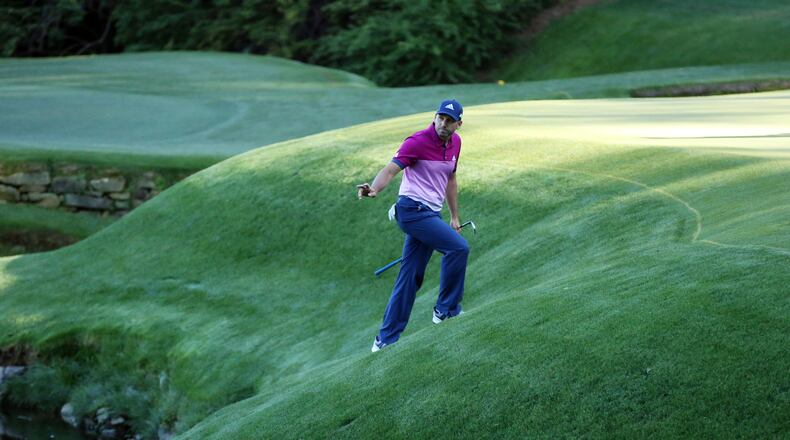 Sergio Garcia's march to his first major title at this year's Masters didn't come without some adventure on the bank fronting the green at No. 13. (Curtis Compton/ AJC)