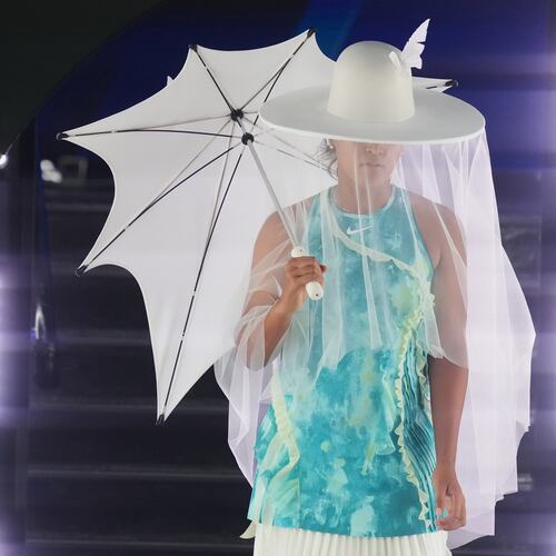 Naomi Osaka of Japan walks onto Rod Laver Arena for her first round match against Antonia Ruzic of Croatia at the Australian Open tennis championship in Melbourne, Australia, Tuesday, Jan. 20, 2026. (AP Photo/Asanka Brendon Ratnayake)