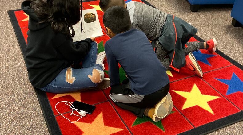 Through the Preface program, students from Berkmar High work on literacy issues with youngsters at nearby Hopkins Elementary.