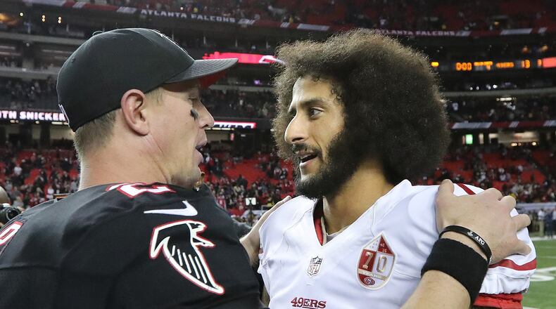 December 18, 2016, ATLANTA: Falcons quarterback Matt Ryan gives 49ers quarterback Colin Kaepernick a hug after a 41-13 victory over the 49ers during an NFL football game on Sunday, Dec. 18, 2016, in Atlanta. Curtis Compton/ccompton@ajc.com